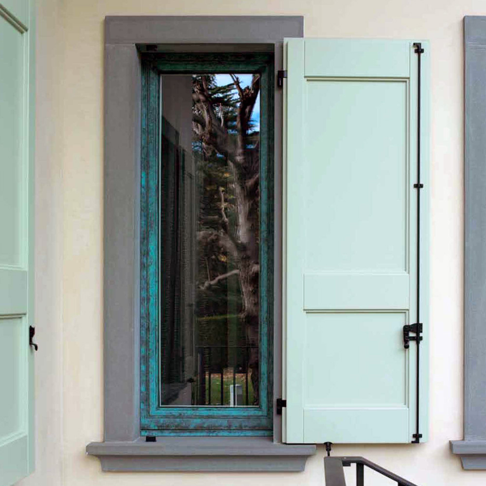 Exterior view of a window with dark wood