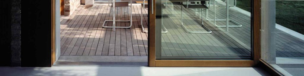 Detail of a wooden lift and slide with oiled finish