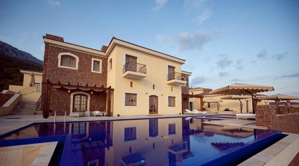 Cover image of the Crimea Breeze Residence with a view of the main facade with wooden fuseruoli windows