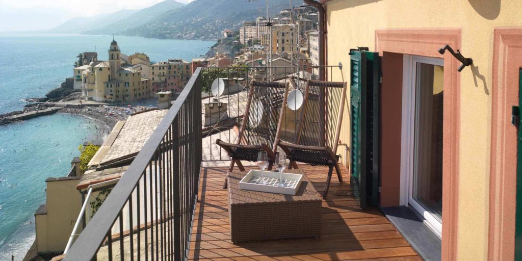 View of a terrace with wooden shutters and windows
